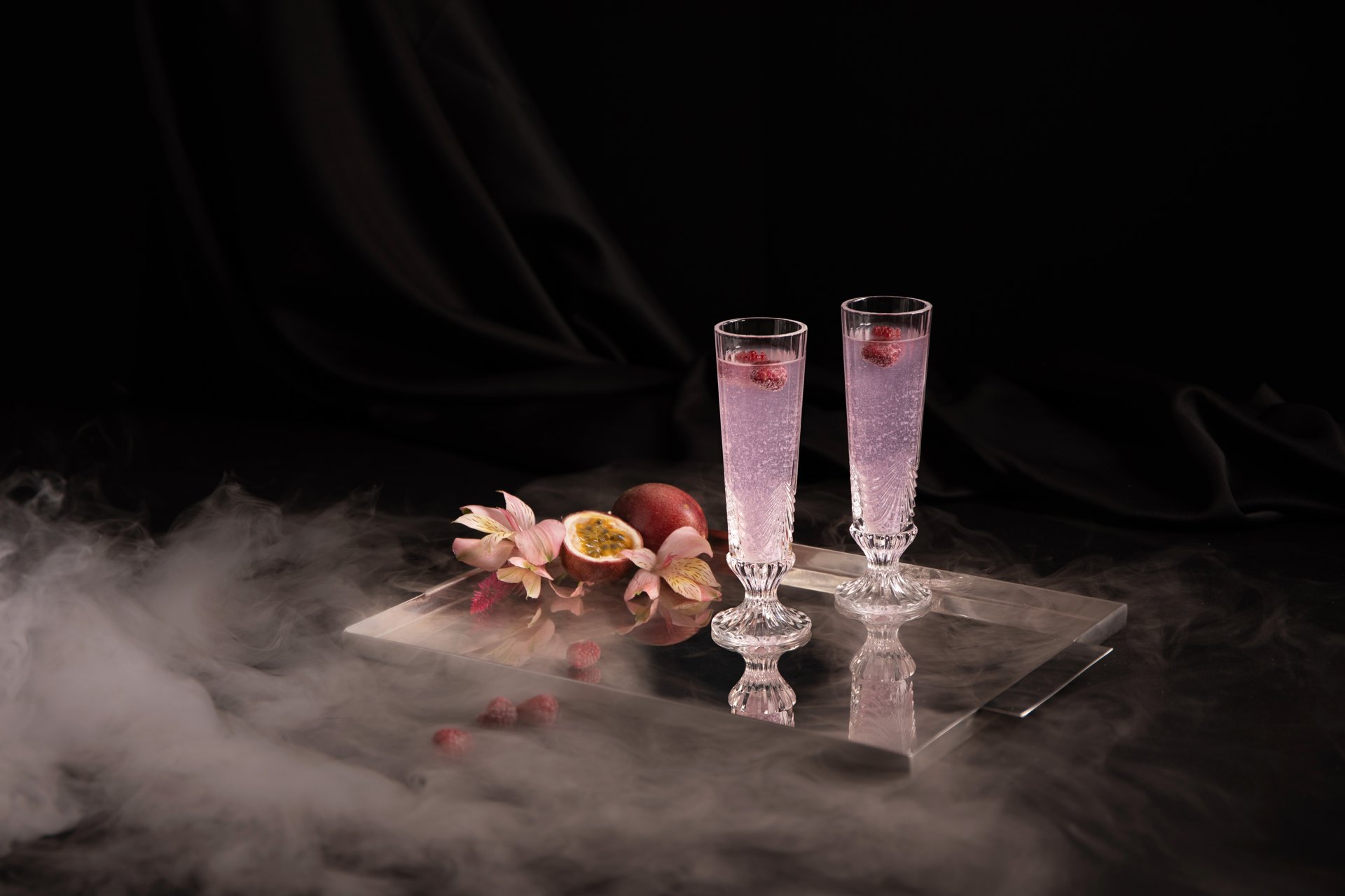 Two sparkling cocktails with passion fruit